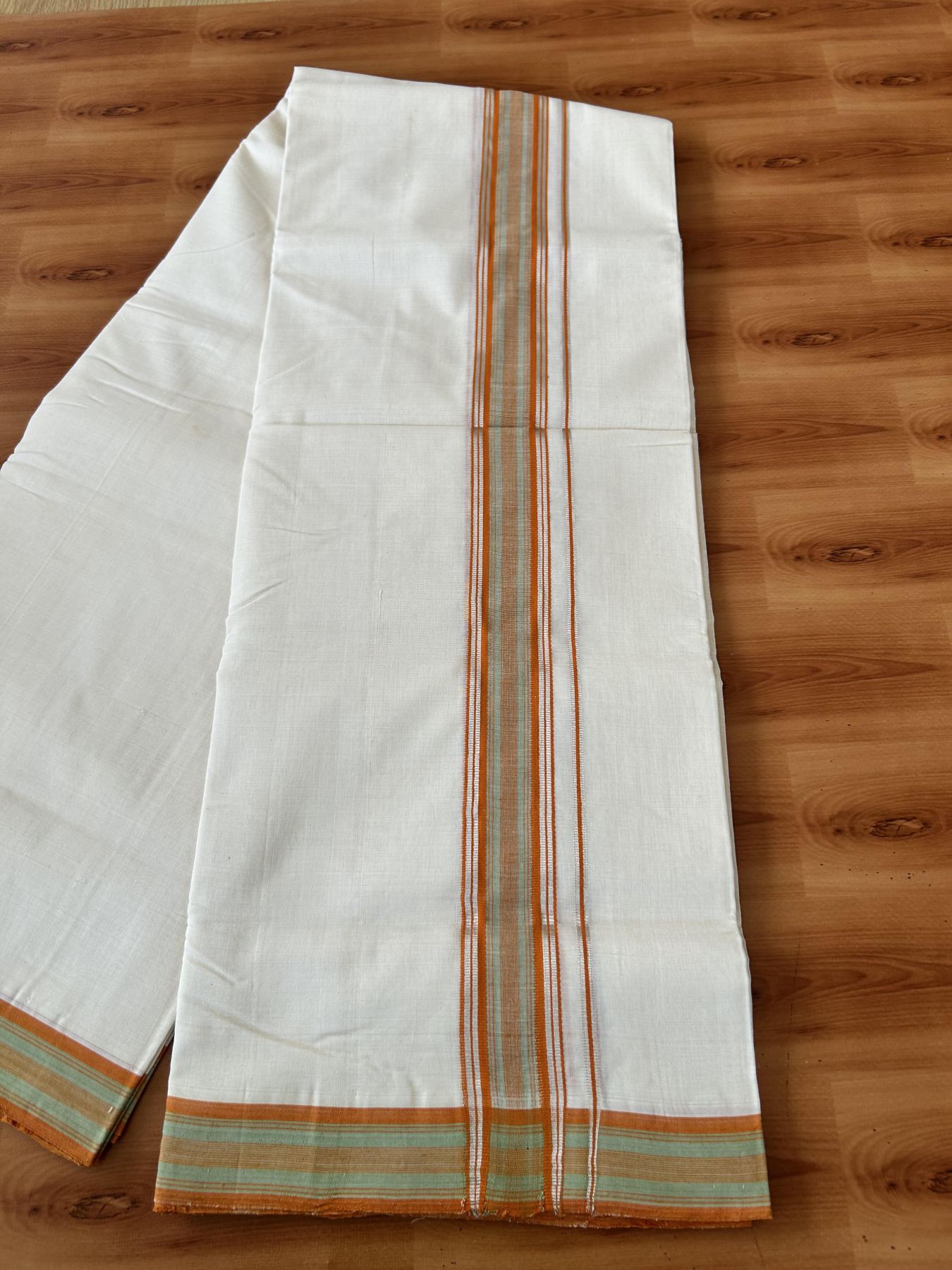 Double Off White (Unbleached) Mundu/Dhoti 25% Discount!! KaithariKada Handloom Unakkupaav - Kerala Handloom - 100% Pure Cotton - 80x90 - 1.75 Inch Silver Kasav Light Green & Orange design Striped Kara - 4 mtr (8.5 Muzham) - 11 KK5459 ABH