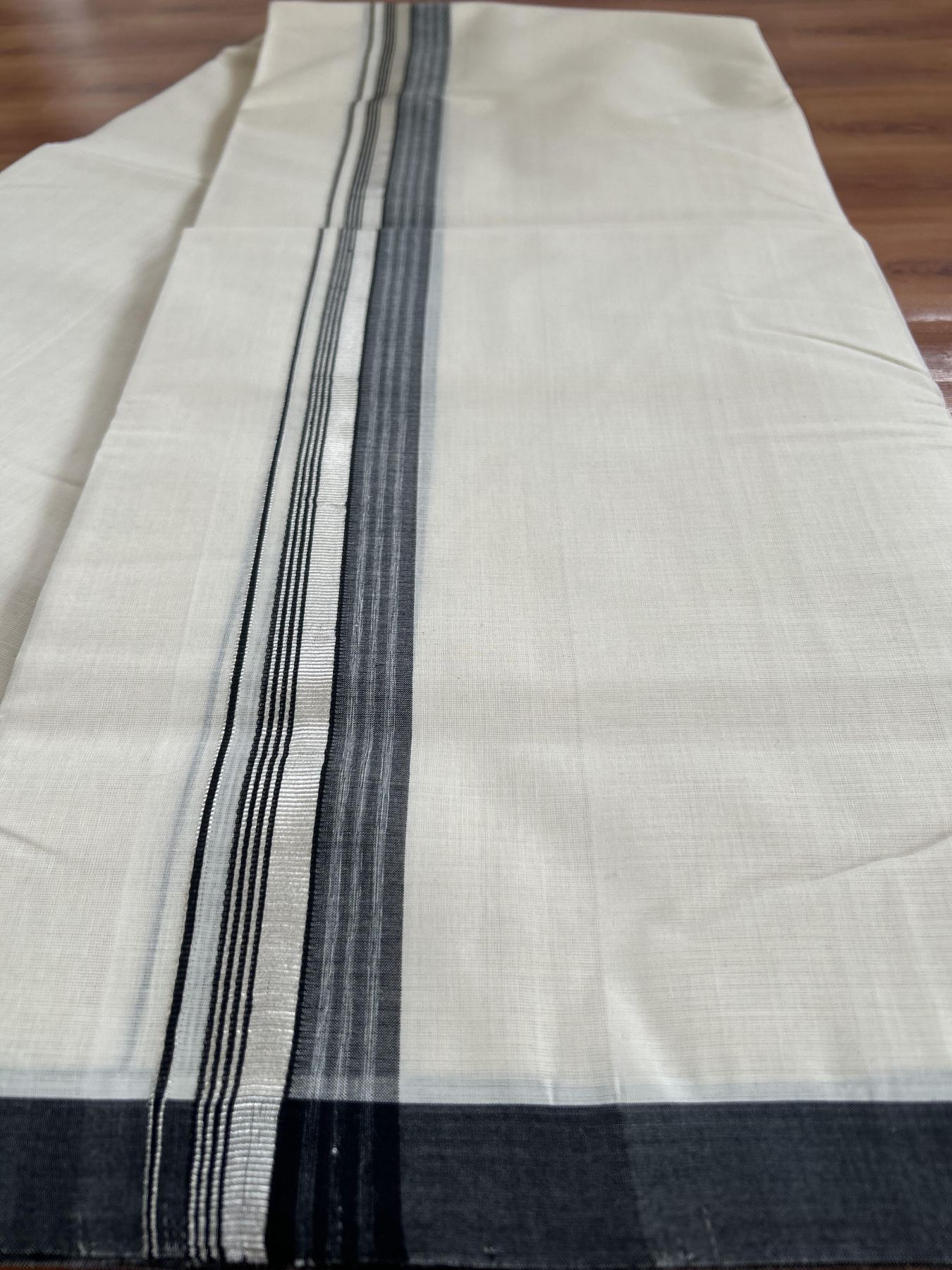 Double Off White (Unbleached) Mundu/Dhoti- 25% Discount! KaithariKada Handloom Millpaav - Kerala Handloom - Cotton - 80x90 - 1.25 inch Silver Kasav & Black Shaded Striped Kara 4.50 meter (10 Muzham) - 29 KK5396 RAM