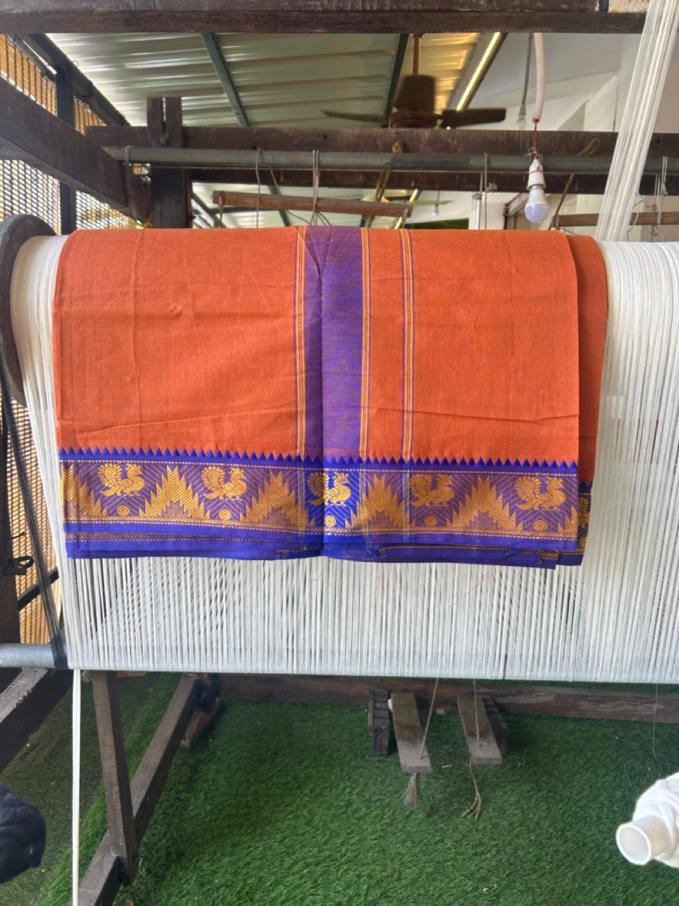 20% Discount! KaithariKada - Cotton Mix - 80x90 thread - 80 % Cotton & 20% Polyester- NORTH INDIAN - ATTACHED GAMCHA 9X5 Dhoti - 2.75 inch Blue & Yellow Kara with Kavi Colour body - Gold Kasavu Green & Blue Peacock Design Border - 108KK5227 PMC