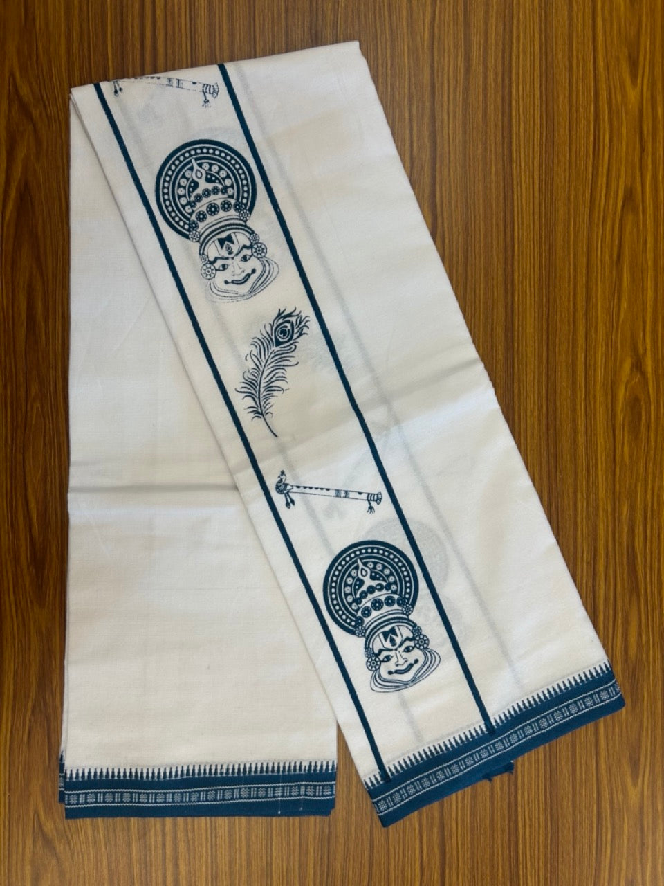 18% Discount! Kaitharikada Pure Cotton - Single Kaily / Lungi - 4 inch Peacock Blue Printed Kadhakali , Peacock Feather & Flute Kuppadam Design kara with White colour body (2 meter / 4 muzham) - 3KK8023 AS