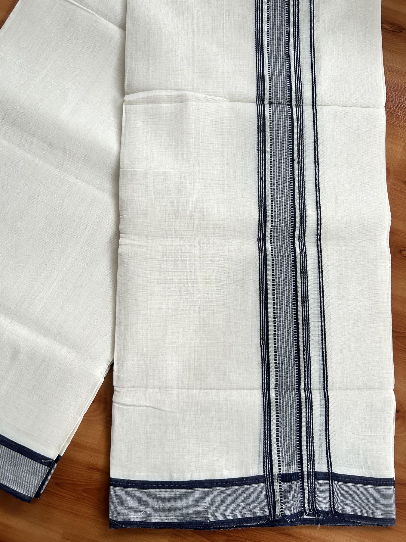 Double Off White (Unbleached) Mundu/Dhoti - 25% Discount! KaithariKada Handloom Unakkupaav Kerala Handloom - Pure Cotton - 80x90 - 1.5 Inch Silver Kasav & Navy Blue Striped Kara 4 Mtr (8.5 Muzham) - 15 KK5438 YAR