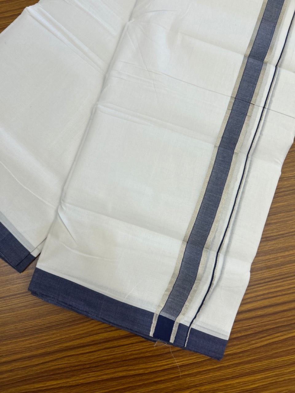 KaithariKada Handloom Millpaav Balaramapuram - 100% Pure Cotton Double Mundu/Dhoti Pure white - 80x90 - 1.25 inch Silver Kasav & Navy Blue Shaded Kara 4 mtr (8.5 Muzham) - 35 KK5263 YAR