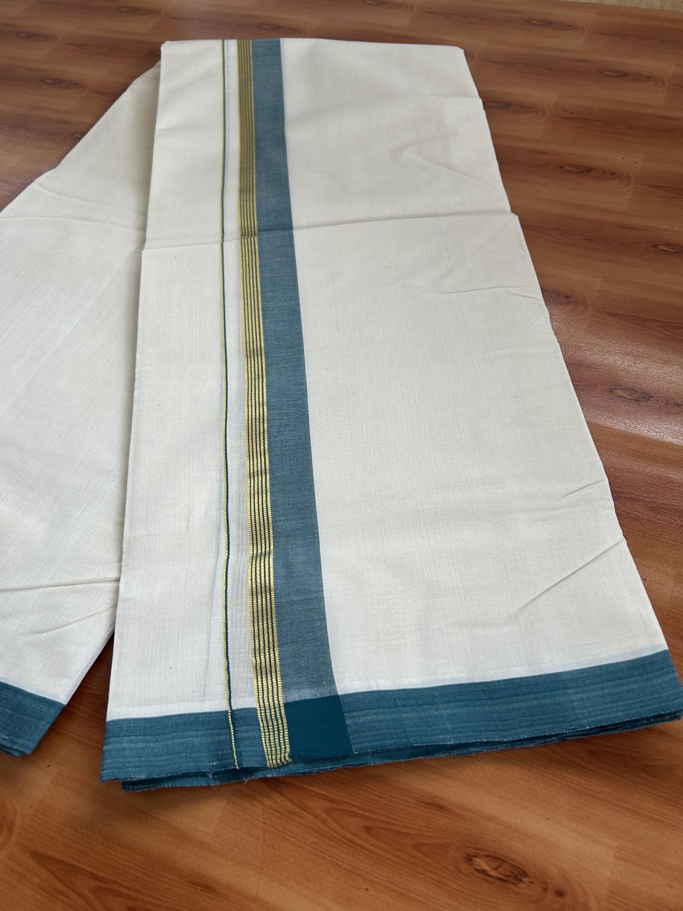 Double Off White (Unbleached) Mundu/Dhoti- 25% Discount! KaithariKada Handloom Millpaav - Kerala Handloom - Cotton - 80x90 - 1.25 inch Gold Kasav & Peacock Blue Shaded Striped Kara 4.50 meter (10 Muzham) - 27 KK5396 RAM