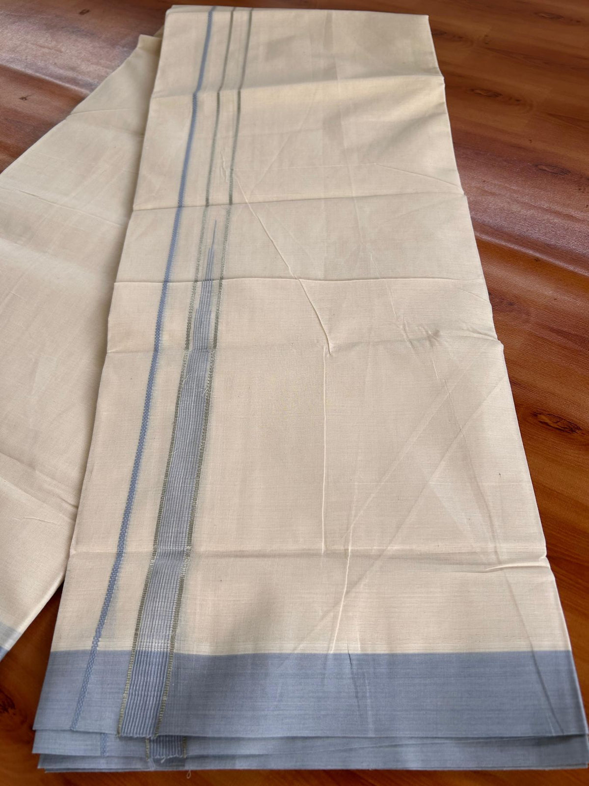 Double Off White (Unbleached) Mundu/Dhoti - 20% Discount! KaithariKada 100% Cotton - 80X90 - 0.75 inch Powder Blue Silver kasav Striped Chutty Kara 4 mtr (8.5 Muzham) - 23 KK5520 PMC