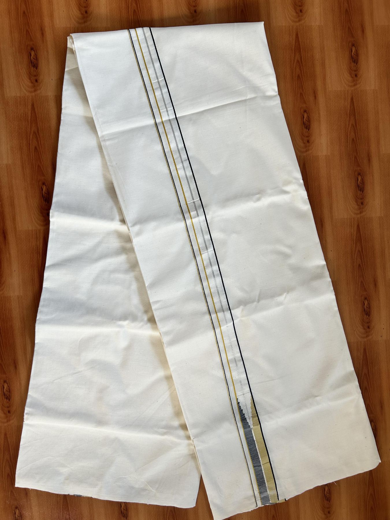 Single Mundu/Dhoti - Off White (Unbleached) 20% Discount !! KaithariKada Balaramapuram 100% Cotton Twisted 100s Thread - 0.75 inch Silver Kasav Black & Yellow Puliyilakkara Chutty (2 meter/4 Muzham) - 4 KK5407 ASH