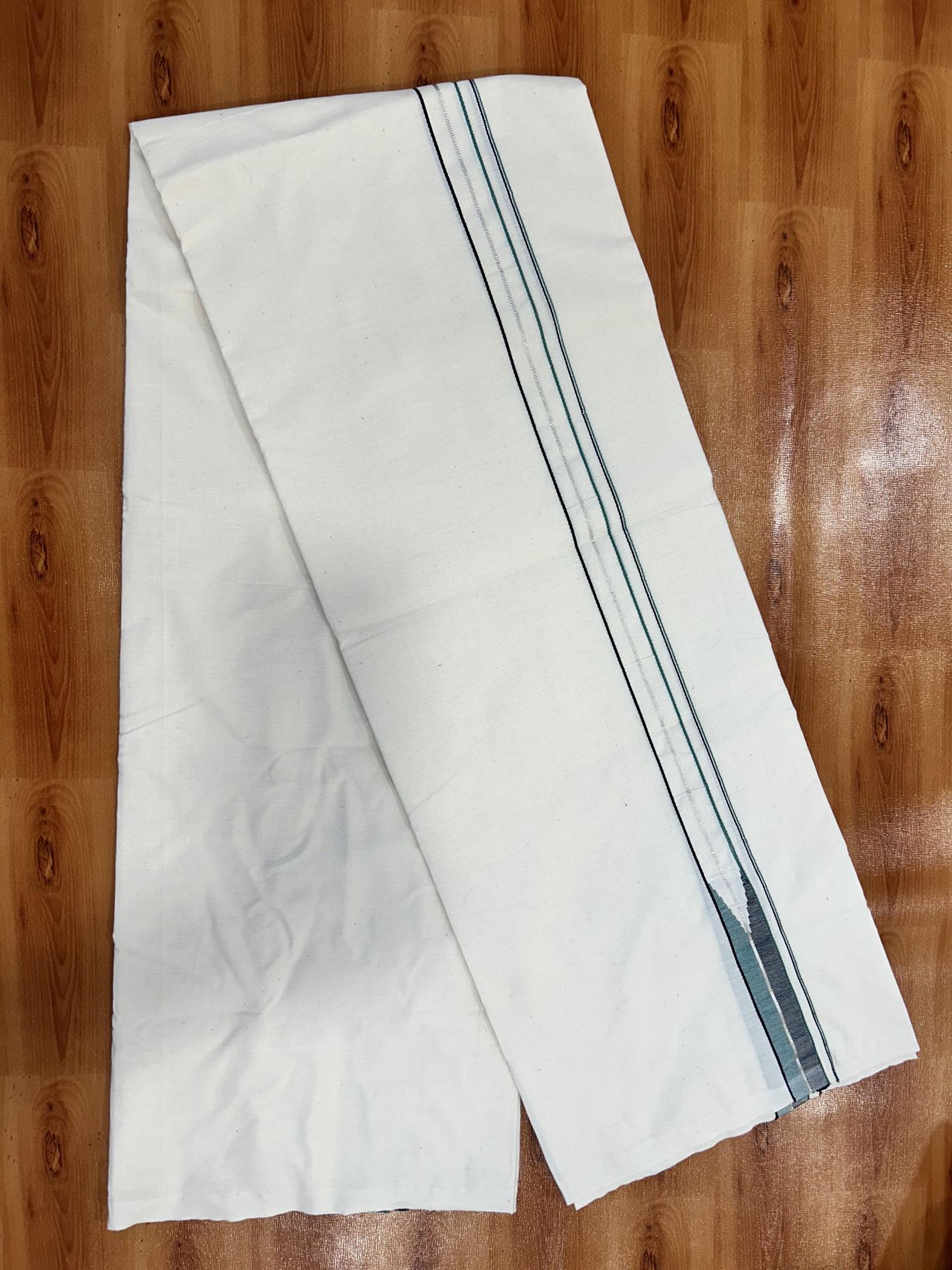 Single Mundu/Dhoti - Off White (Unbleached) 20% Discount !! KaithariKada Balaramapuram 100% Cotton Twisted 100s Thread - 0.75 inch Silver Kasav Black & Teal Green Puliyilakkara Chutty (2 meter/4 Muzham) - 1 KK5407 ASH