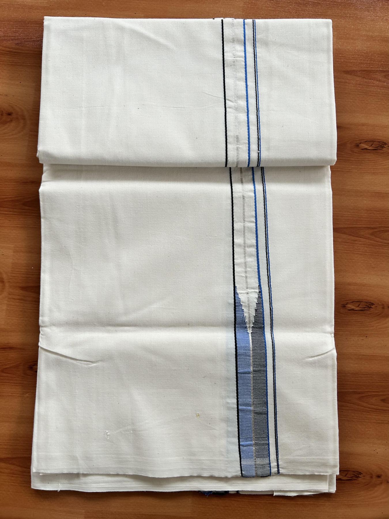 Single Mundu/Dhoti - Off White (Unbleached) 20% Discount !! KaithariKada Balaramapuram 100% Cotton Twisted 100s Thread - 0.75 inch Silver Kasav Black & Blue Puliyilakkara Chutty (2 meter/4 Muzham) - 6 KK5407 ASH