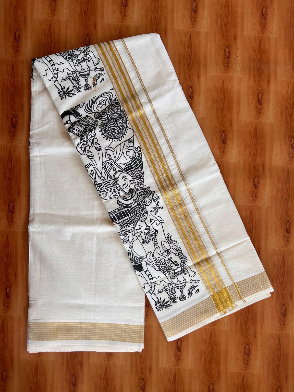 Double Off White (Unbleached) Mund/Dhoti - 20% Discount! KaithariKada Mixed Cotton - 60s - 1.5 inch Gold Kasav Striped Kara with Black Kerala Traditional Printed Design 4 mtr (8.5 Muzham) - 56 KK5520 PMC