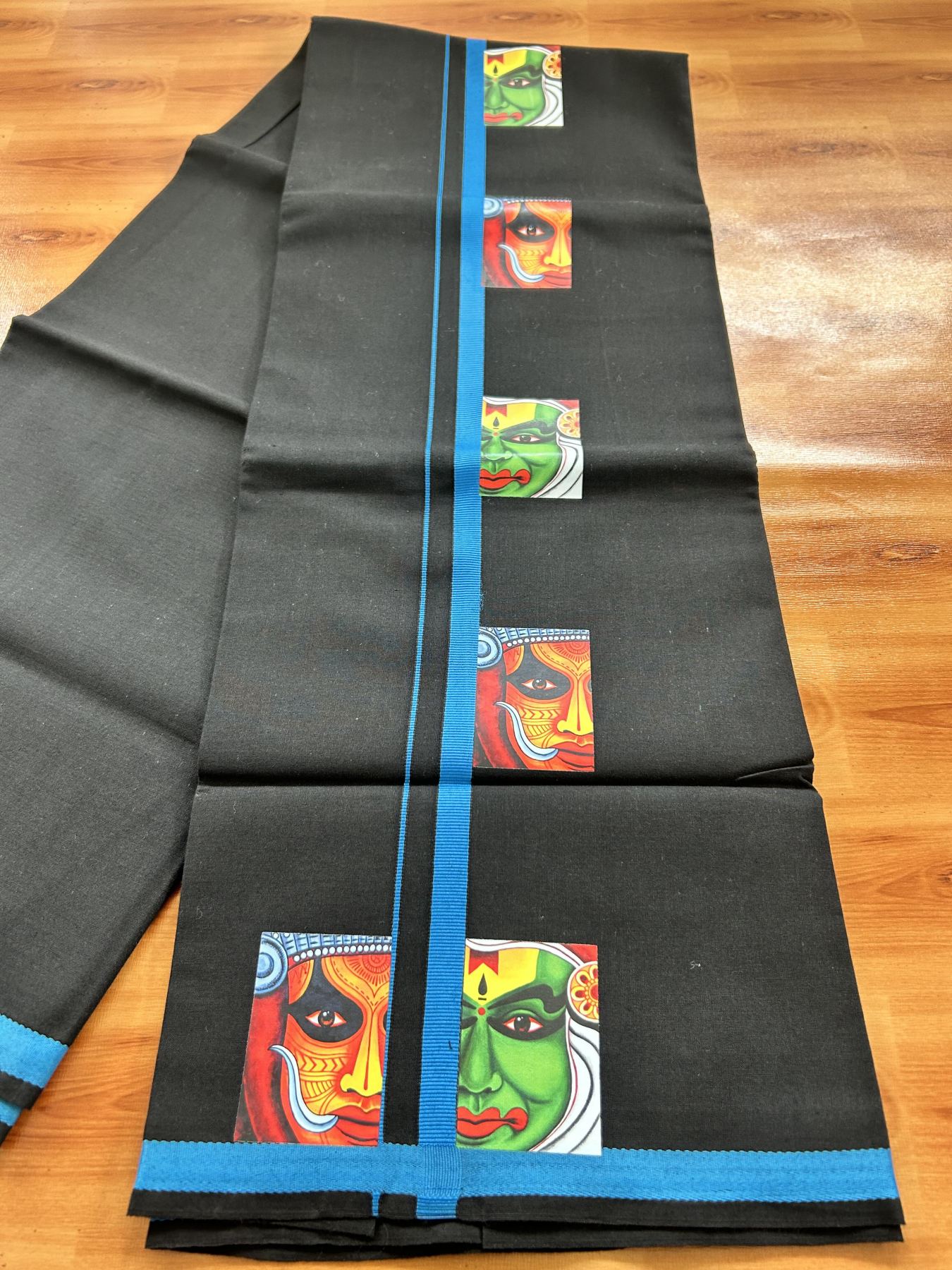 Single Kaily / Lungi- 20% Discount !! Kaitharikada - Pure Cotton - (40s) - 0.5 inch Light Blue Theyyam & Kathakali Printed Design Kara with Black colour Body (2 meter / 4 muzham) - 1 KK8062 GAN