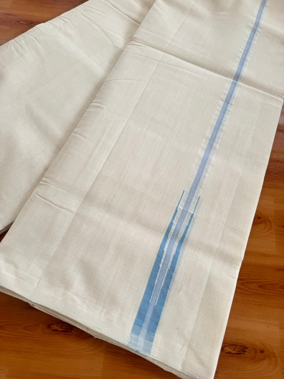 Double Off White (Unbleached) Mundu/Dhoti - 25% Discount!! KaithariKada Handloom Millpaav - 100% Pure Cotton - 80x90 - 0.75 inch Puliyilakkara Light Blue Stripes Chutty 4 meter (8.5 muzham) - 3 KK5507 RAM