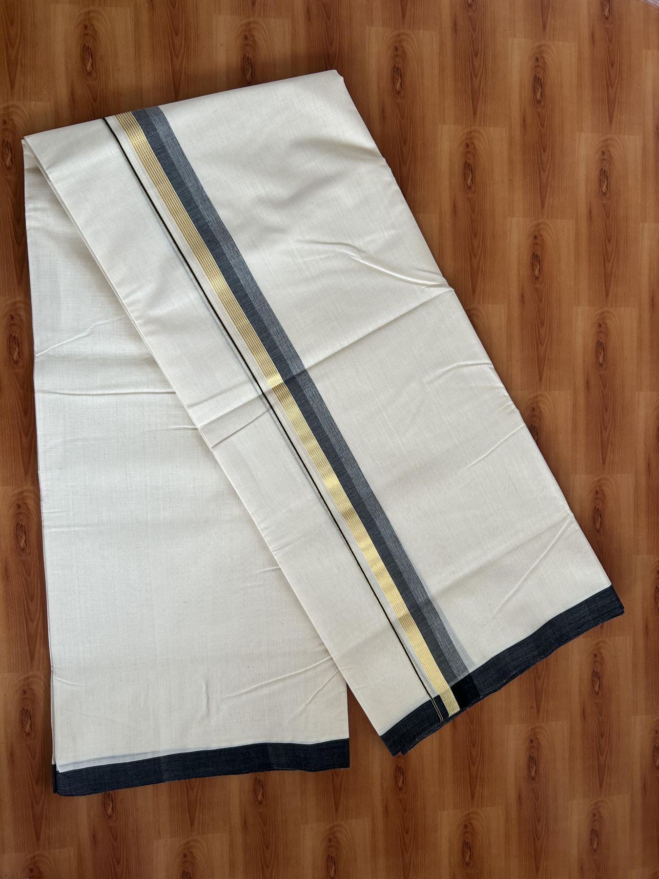 Double Off White (Unbleached) Mundu/Dhoti- 25% Discount! KaithariKada Handloom Millpaav - Kerala Handloom - Cotton - 80x90 - 1.25 inch Gold Kasav & Black Shaded Striped Kara 4.50 meter (10 Muzham) - 26 KK5396 RAM