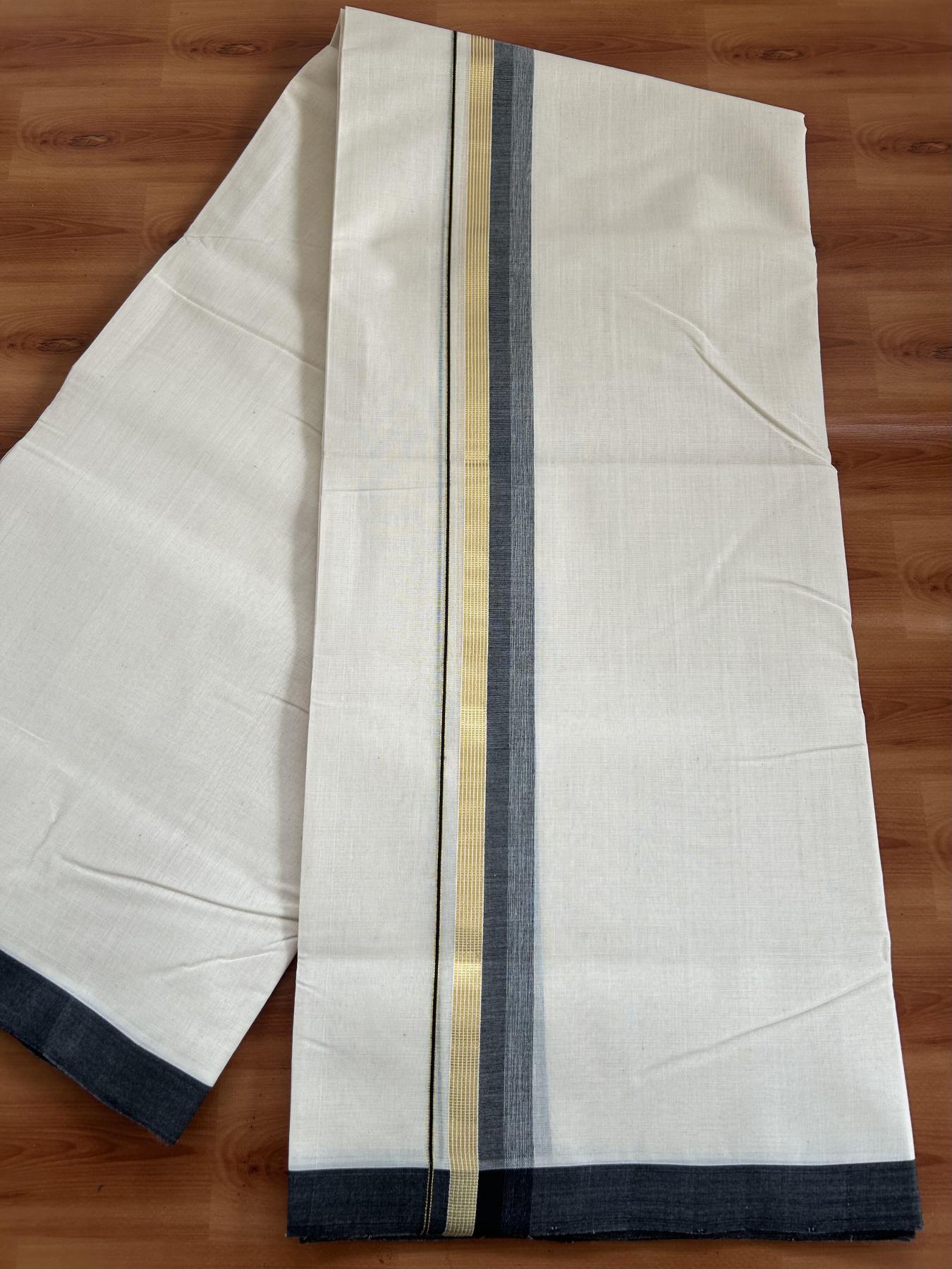Double Off White (Unbleached) Mundu/Dhoti- 25% Discount! KaithariKada Handloom Millpaav - Kerala Handloom - Cotton - 80x90 - 1.25 inch Gold Kasav & Black Shaded Striped Kara 4.50 meter (10 Muzham) - 26 KK5396 RAM