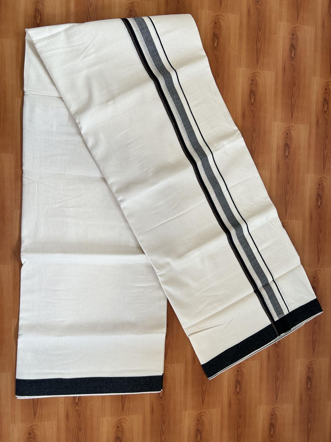 Single Mundu/Dhoti - Off White (Unbleached) 29% Discount !! KaithariKada Balaramapuram 100% Cotton Twisted 60s Thread - 1 Inch Silver Kasav & Black & Brown Shaded Kara (2 meter /4 muzham) - 12 KK5393 GL