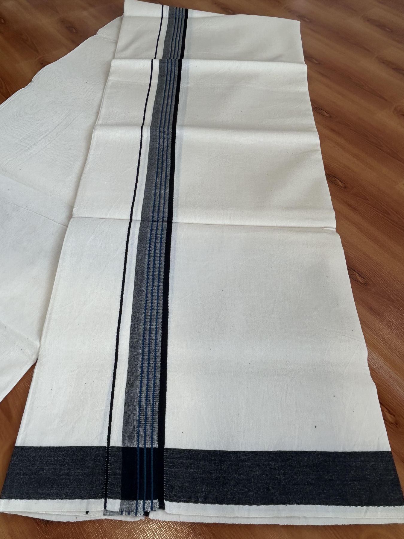 Single Mundu/Dhoti - Off White (Unbleached) 29% Discount !! KaithariKada Balaramapuram 100% Cotton Twisted 60s Thread - 1 Inch Peacock Blue & Black Shaded Striped Kara (2 meter /4 muzham) - 24 KK5393 GL