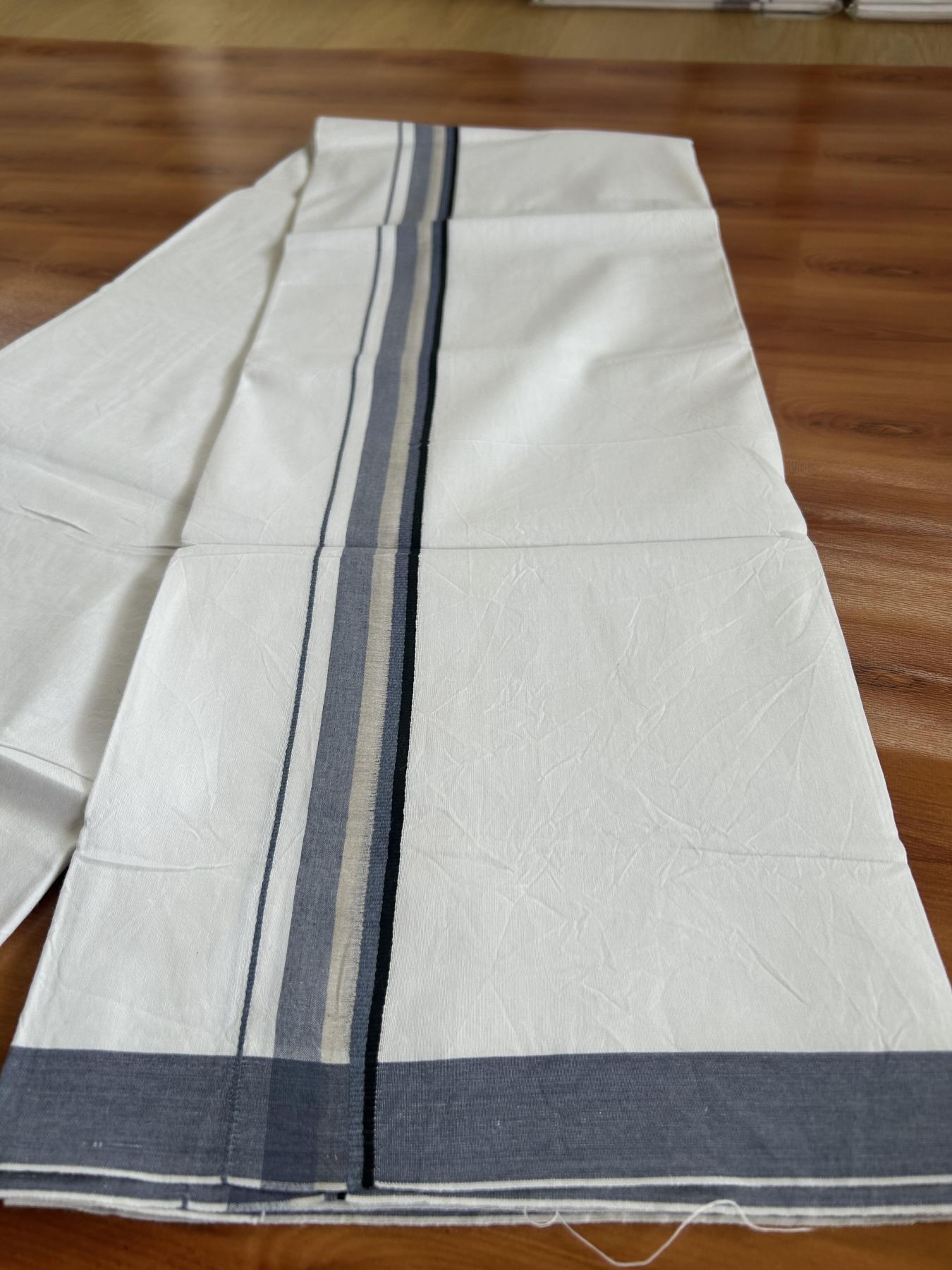 Single Mundu/Dhoti  - Pure White - 29% Discount !! KaithariKada Balaramapuram 100% Cotton - Twisted 60s Thread -1 Inch Silver Kasav & Black & Greyish Blue Shaded Kara (2 meter / 4 muzham) - 31 KK5393 GL