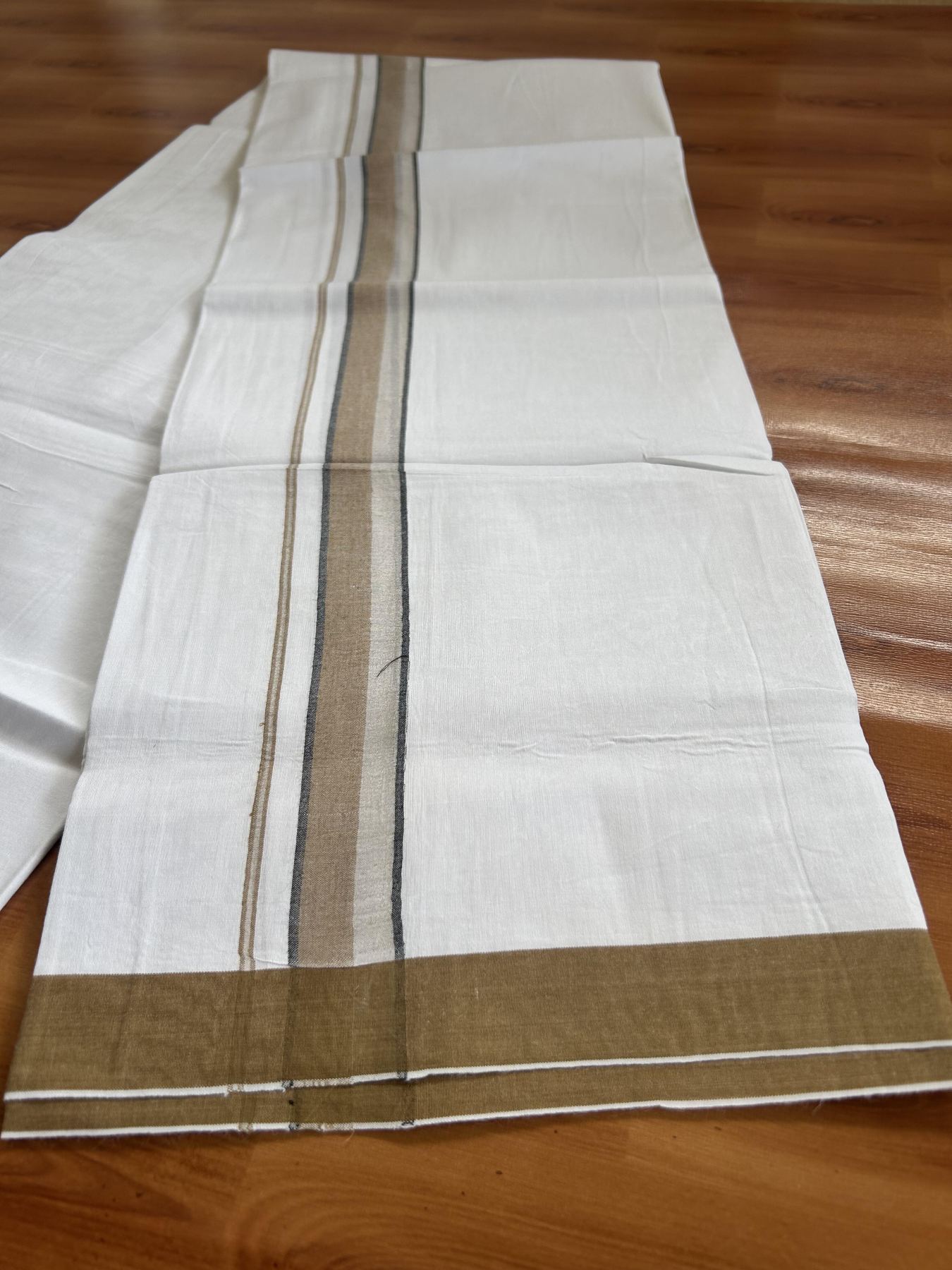 Single Mundu/Dhoti  - Pure White - 29% Discount !! KaithariKada Balaramapuram 100% Cotton - Twisted 60s Thread -1 Inch Silver Kasav & Black & Sand Brown Shaded  Kara (2 meter / 4 muzham) - 40 KK5393 GL