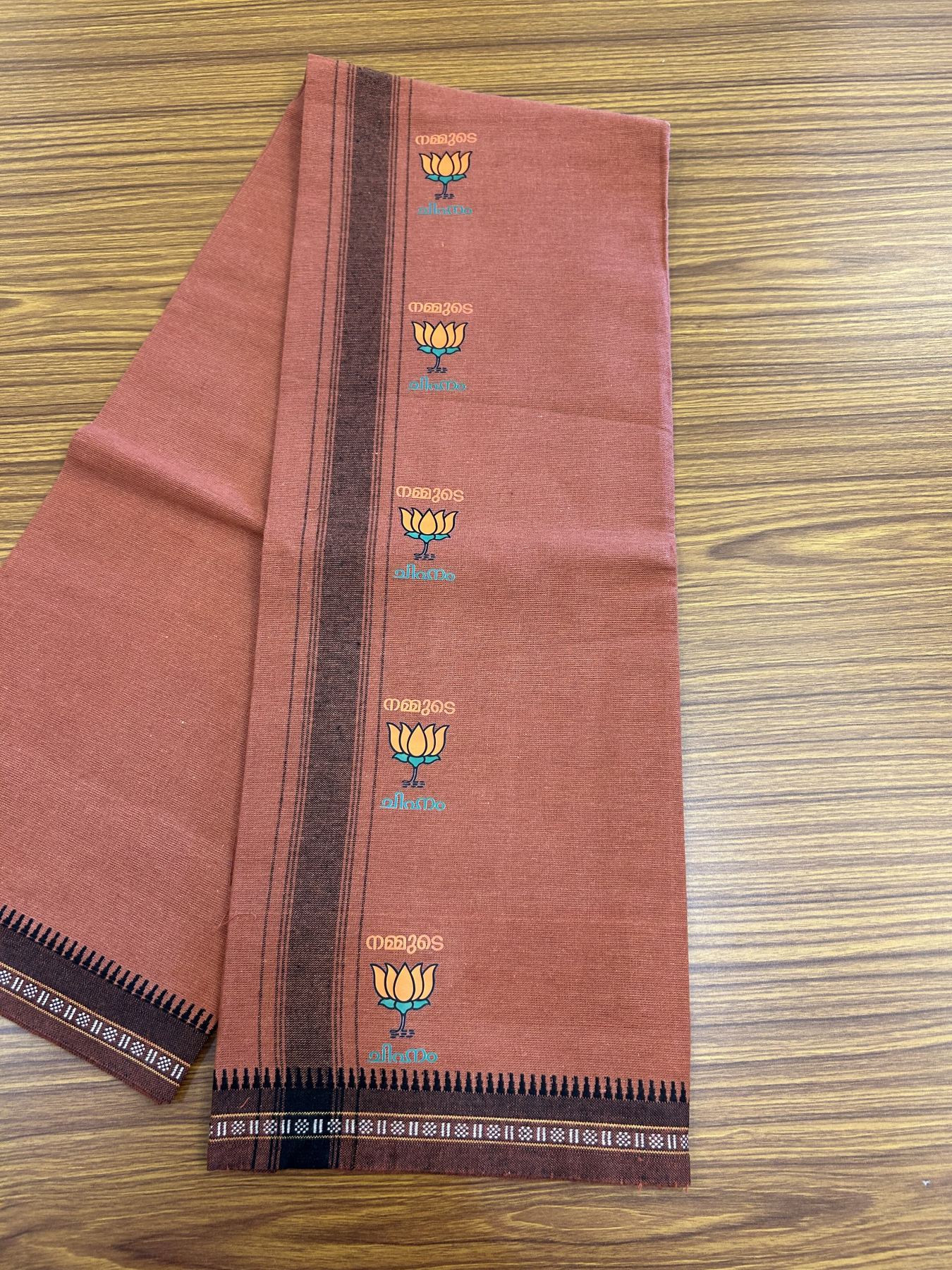 Bjp Veshti - Kaitharikada -  Single Kaily / Lungi - Polyster + Cotton - 20s twisted -  3.5 inch Black striped Bjp Lotus Printed Kuppadam Border with Kavi colour body (2 meter / 4 muzham)  - 12 KK8045 GAN