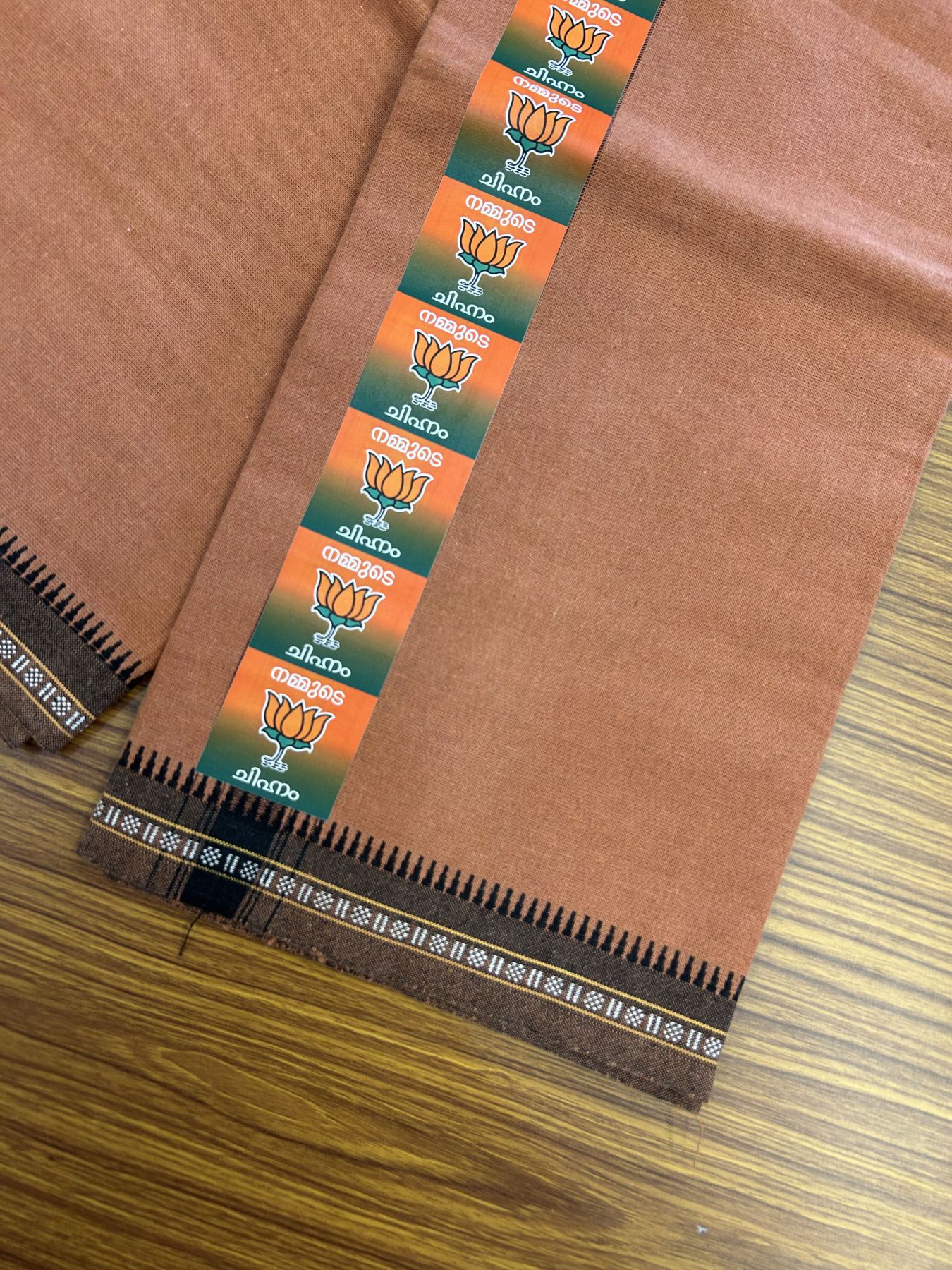 Bjp Veshti - Kaitharikada -  Single Kaily / Lungi - Polyster + Cotton - 20s twisted -  2 inch Bjp Lotus Printed Kuppadam Border with Kavi colour body (2 meter / 4 muzham)  - 11 KK8045 GAN