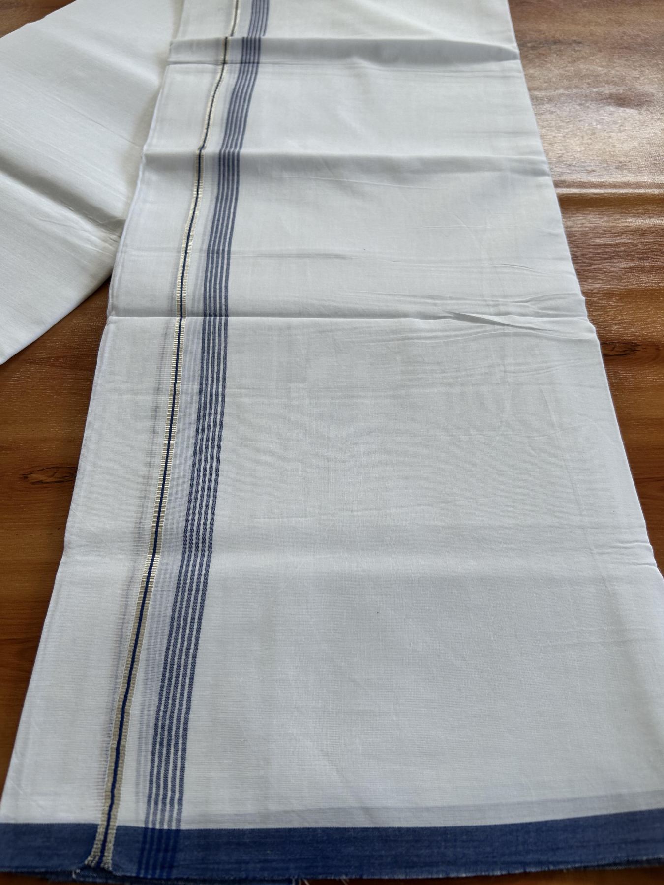 Double Pure white Mundu/Dhoti-  20% Discount ! KaithariKada Balaramapuram Pure Cotton - 100x80 - 0.5 inch Silver Kasav & Blue Shaded striped Kara - 3.90 m (8 muzham) - 32 KK5444 VIN