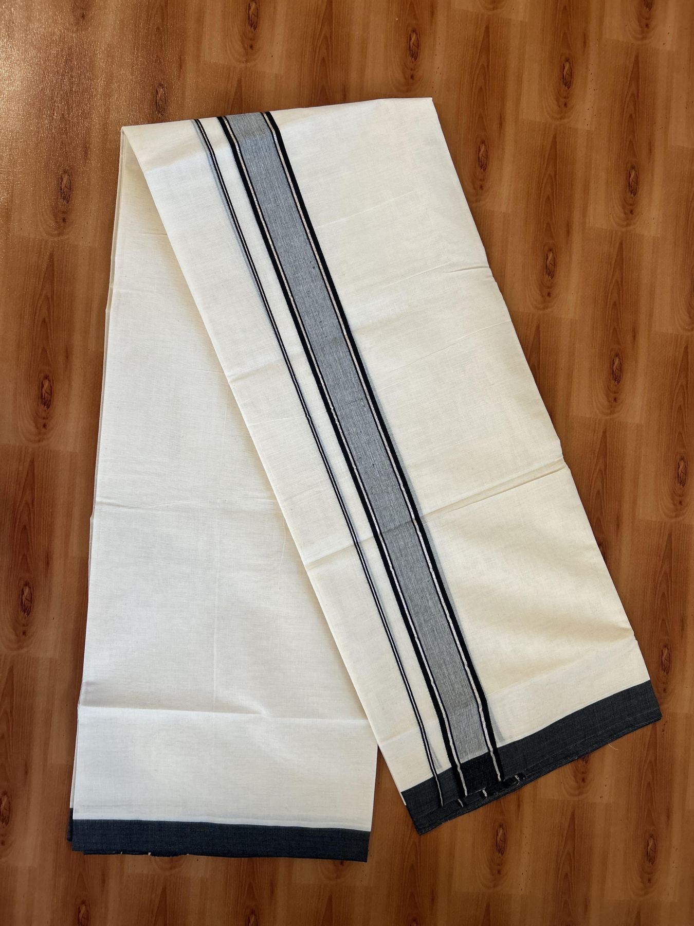 Double Off White (unbleached) Mundu/Dhoti - 20% Discount ! KaithariKada Balaramapuram - 100% Cotton - 60s- 1.5 inch Silver Kasav & Black Shaded Kara 4 mtr (8.5 muzham) - 7 KK5398 PMC