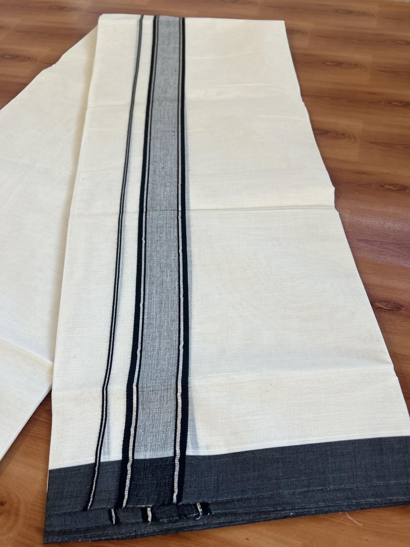 Double Off White (unbleached) Mundu/Dhoti - 20% Discount ! KaithariKada Balaramapuram - 100% Cotton - 60s- 1.5 inch Silver Kasav & Black Shaded Kara 4 mtr (8.5 muzham) - 7 KK5398 PMC